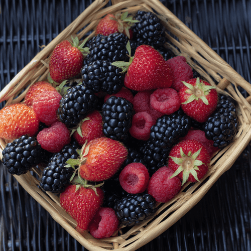 A close photo of a basket of berries