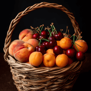 A basket full of Stone fruits